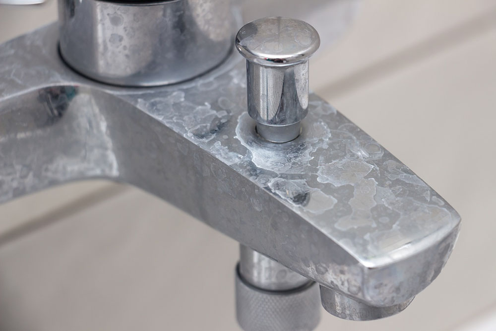 faucet with white chalky residue